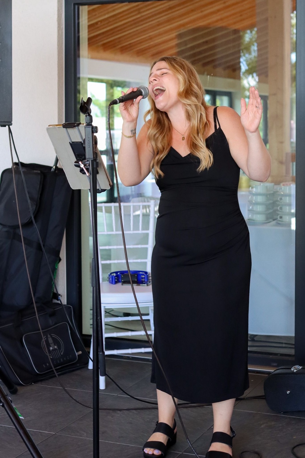 Brittany singing at a wedding
